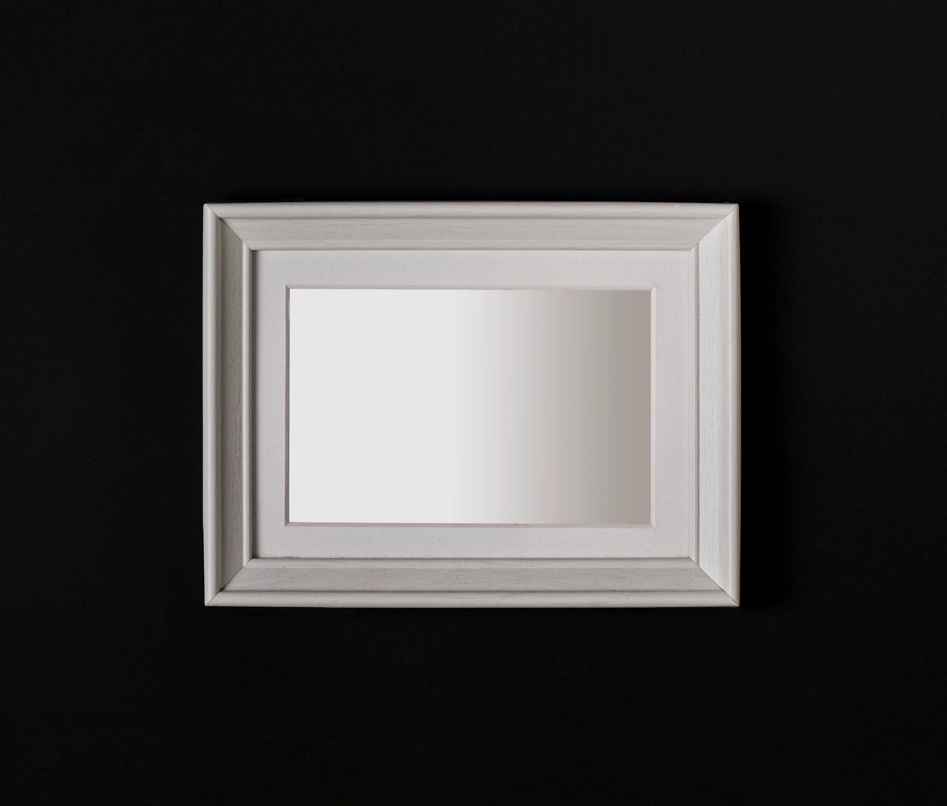 Empty white frame on black ground
