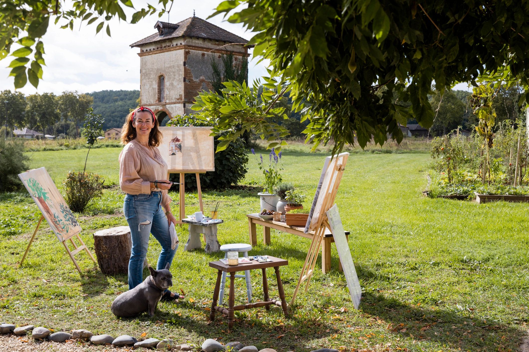 Artist standing outdoors during an art class